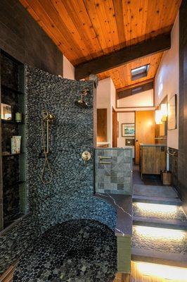 Spa like bathroom featuring nature inspired stonework.