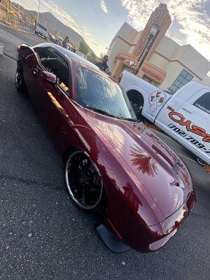 Nicks bagged Challenger sitting right on Water Street Henderson Hot Rod Days Car Show 2024