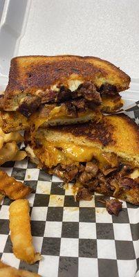 Thursday special! Burnt end grilled cheese! Brisket is tender and tasty, there's 2 types of cheese with a crunchy crusty bread.