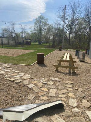 Patio being built around the sand court