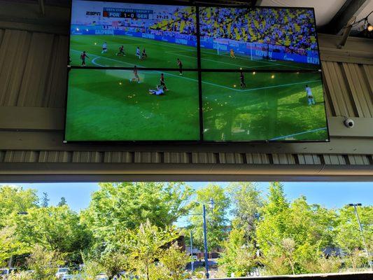 Out side seating area with big screen.