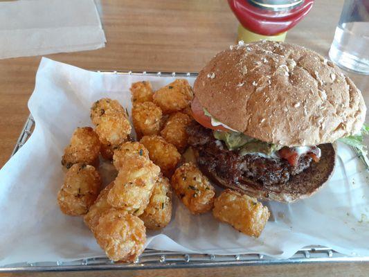 Avocado bacon smash burger with smash tots