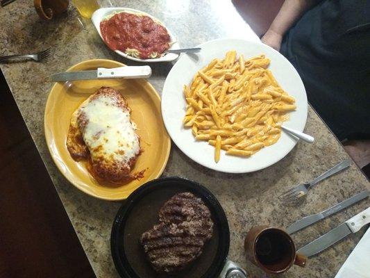 Chicken parmesan, side spaghetti, penne alla vodka, chopped sirloin steak