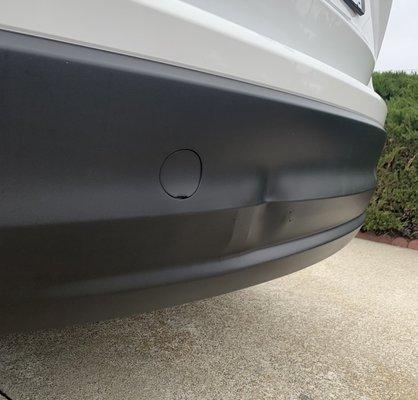 Bumper dent.