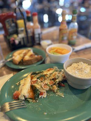 Veggie O Omelet! Egg whites, onions, bell peppers, and baby spinach. Comes with a fruit cup and cottage cheese! What's not to love?