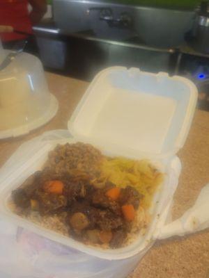 Tasty oxtail over rice w/black-eyed peas and delicious cabbage