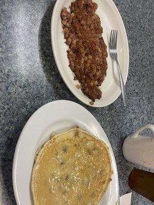 corned beef hash and a blueberry pancake