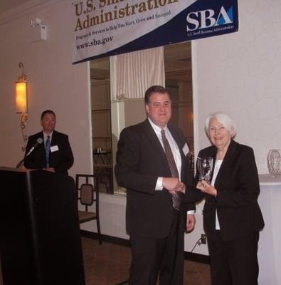 Owner Robert Flude receiving prestigious SBA 2014 award.