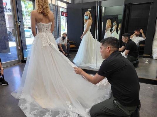 Wedding Dress Hem Adjustment: We shortened the train on a lace wedding dress, ensuring it flowed beautiful, by Ramy Suares Master Tailor