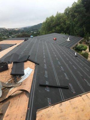 Composition shingle in progress waterproofing layer Oakland, CA