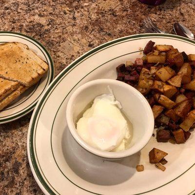 Corned beef hash with poached eggs and rye toast. So yummy!!!