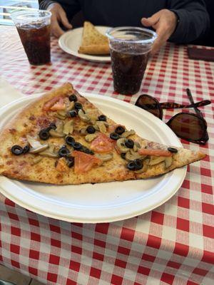 Giant slice of veggie pizza