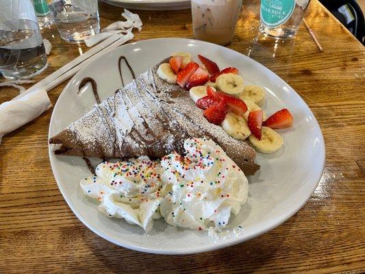 Chocotella crepe with the coconut macchiato in the background