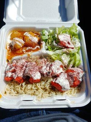 Chicken over rice with side salad and curry potatoes