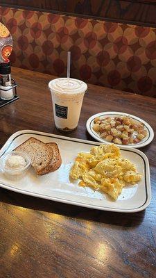 Cheese eggs, potato with a side of toast. & the iced caramel macchiato that had me in a chokehold lol