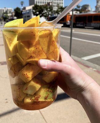 Sliced mango with Tajín