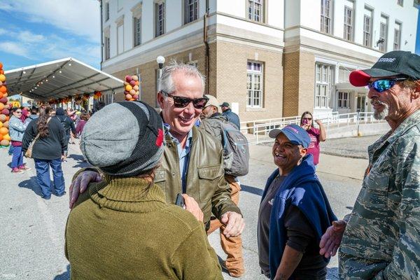 Turkey Giveaway 2019 - Thomas J. Henry handing out a turkey bag