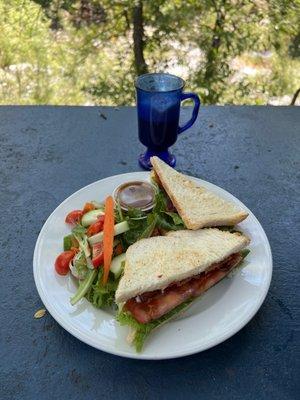 Blt with salad and cappuccino