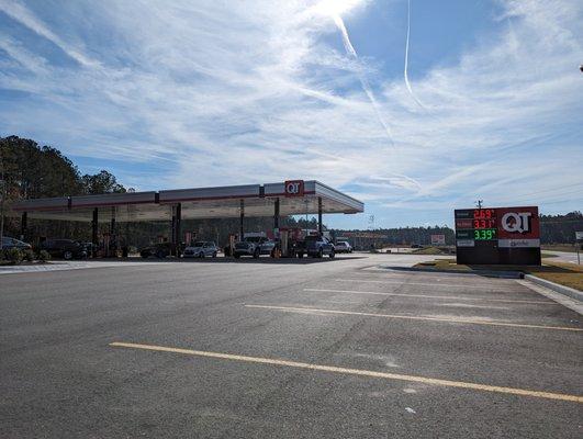 Outside the gas station. Street sign on Little Neck Road. There are 16 pumps at this QT.