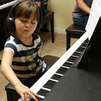 Each students gets three 10-minute blocks of time at the digital station playing with Piano Marvel.