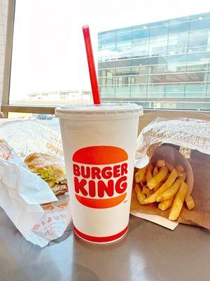 Original Chicken Sandwich combo meal (small) with a view of the tarmac and mountains (not pictured)