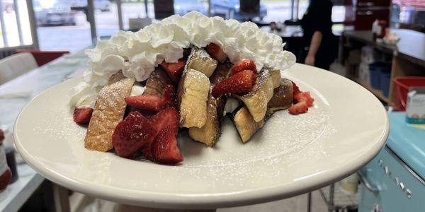 French toast delight, three slices of French toast stuffed with cream cheese and strawberries