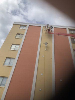 Outside access birds nest removal from dryer vent on the beach