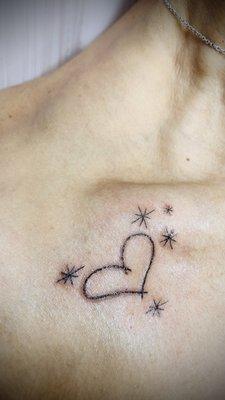 Heart & twinkling stars collar bone tiny tattoo