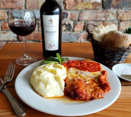 Chicken Parmigiana Served with spaghetti or with our delicious homemade mashed potatoes and a glass of Amarone Graal.