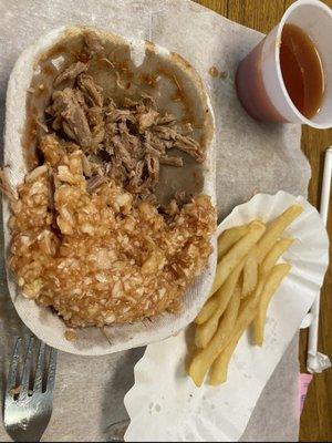 This is a tray of bbq pork with Red slaw. What in the world?  Must be an acquired taste. All I can say is, bless their hearts.