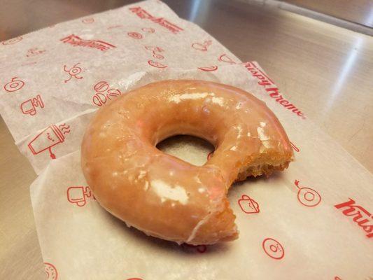 Free hot donut from the conveyor belt