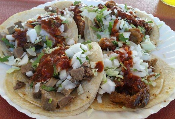 5 tacos with everything on top. That red salsa is real good. 3 tripas and 2 lengua.