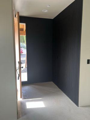 Entry with Hidden Door in Black Panel New Construction