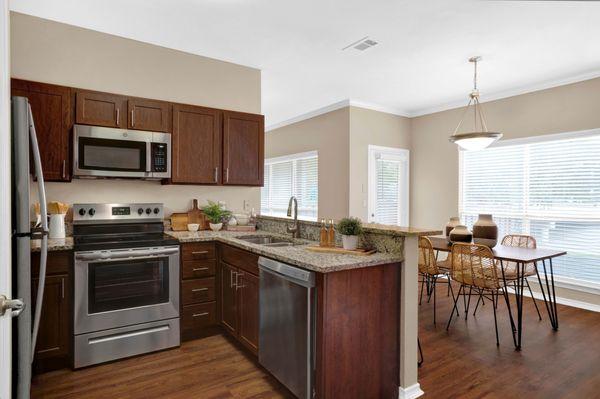 Kitchen with view of dining room at Villas at Preston Creek