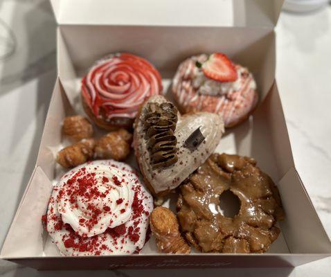 Clockwise from top L: guava cream cheese, strawberry cheesecake, salted caramel, red velvet and tiramisu at the center