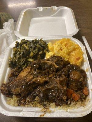 Oxtail, greens, Mac n chz. Hubby had the Goat and it was tender!Okay then! Have the Dweet Tea with Pineapple.