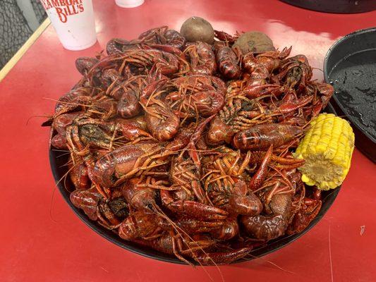 6lbs of boiled crawfish with potatoes and corn.