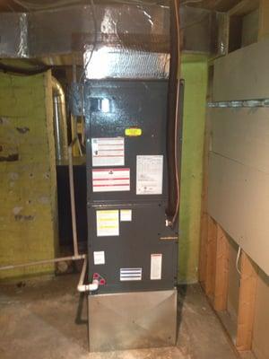 A newly installed heat pump air handler provides year-round comfort efficiently