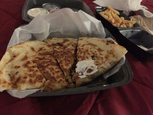 Spicy chicken quesadilla and a side of fries