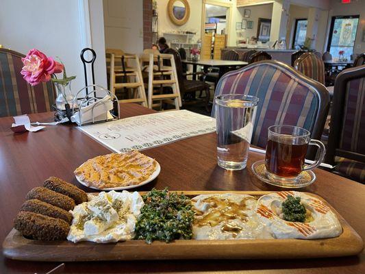 Falafel, yogurt dip w/feta cheese, tabbouleh salad, baba ganoush, hummus, muhamara, mint tea.