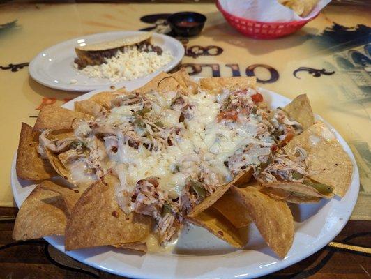 Chicken and cheese nachos and a beef and cheese taco