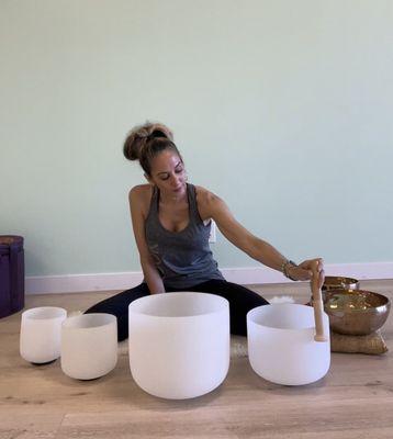 The Wiser Yogi yoga Studio.  Instructor Angelina Performing her sound healing therapy session.