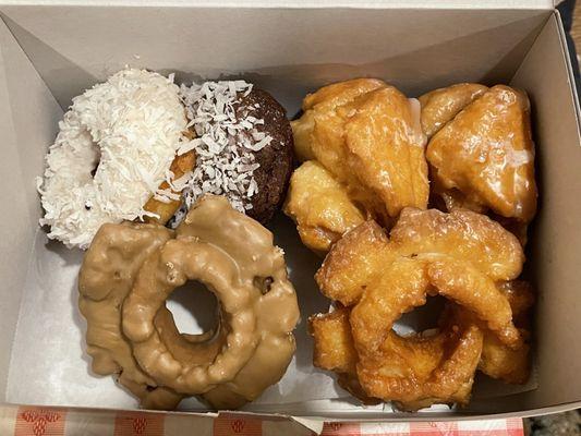 Regular donuts ($10.50 USD for 6); coconut cake, chocolate coconut cake, two old-fashioned and two buttermilk