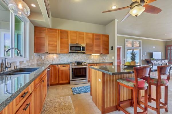 African Mahogany cabinets with granite counter tops.