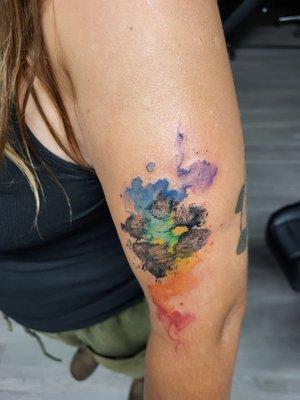 Her dogs paw print with watercolor rainbow bridge