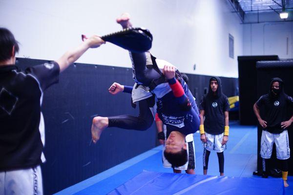 We use flips to practice working through fear and improving coordination.