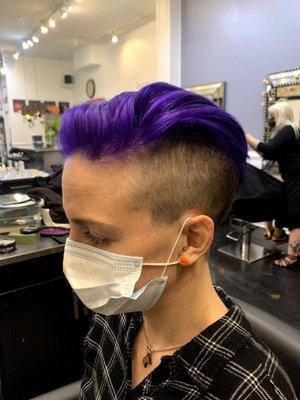 Barber short haircut with targeted blonding and violet over the top.