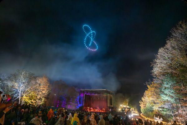 Drone show over stage at a concert / festival.