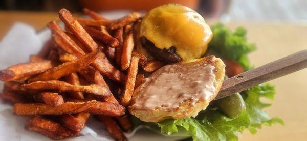 American burger w/ cheddar cheese and sweet potato fries. Looks great, but tastes ehhh. Seasoning would help...