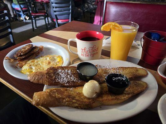 French toast with over hard eggs and bacon. We added sausage patties for $4 more